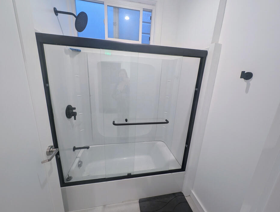 Bathtub with rainfall shower